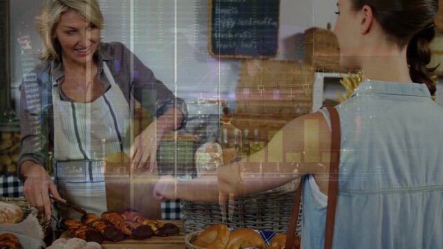 Female baker in apron bagging bread with tongs into paperbag at counter as woman customer reaching