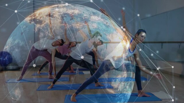 Instructor cueing yoga, students mirroring lunges on blue mats for flow, globe overlay intensifying