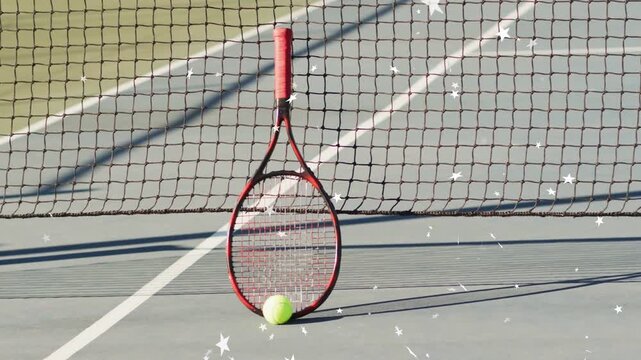 Red-handled racket leaning against net and ball resting, frames causing sparkle overlay for sports