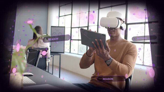 Man with VR headset tapping tablet in office causing REASON PATTERN labels and analyzing UI design