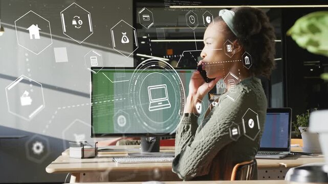 Vertical video: Woman speaking on phone at desk, call activating HUD hex icons for task management