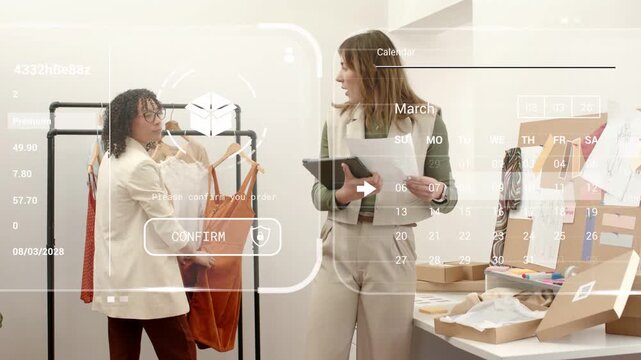 Two fashion staff lifting orange dress and using tablet while HUD map charts confirming shipping