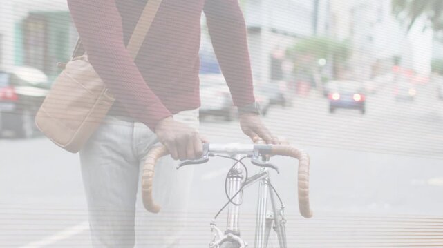 Cam pulling back revealing commuter pushing bicycle urban street, scanline then colorbar obscuring