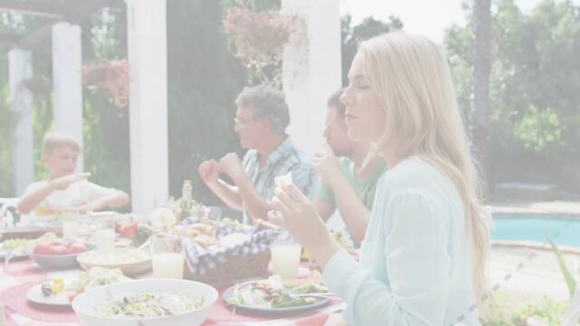 Hand reaching table causing family passing food, woman turning, animated labels showing shared meal