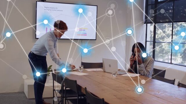 Man sorting docs using device in business meet charts updating nodes rising as woman viewing laptop