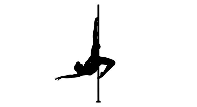 A striking pole dance pose captured in a dark silhouette