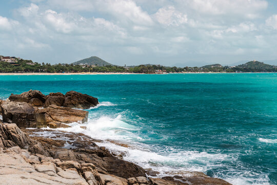 Rocky tropical coast with turquoise sea waves on Koh Samui Thailand