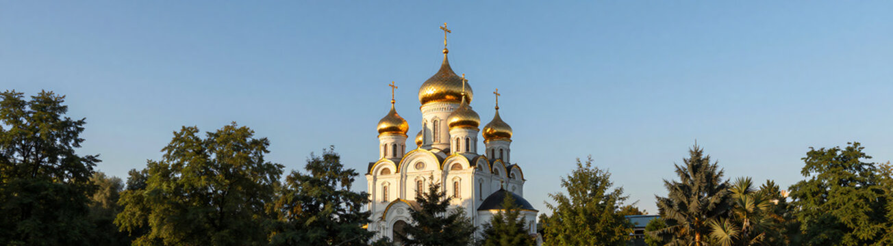 serene orthodox church golden domed roof illuminated crucifix soar lush greenery brilliant blue morning sky warm