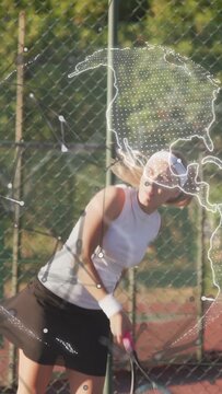 Vertical video: Woman tennis player tossing and serving, preparing return, sports globe overlaying