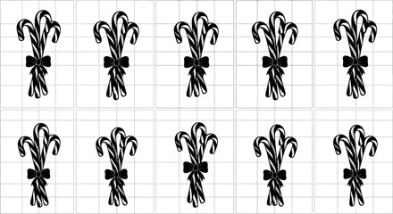 Set of elegant black fleur de lis designs with bows on grid paper background © Prema
