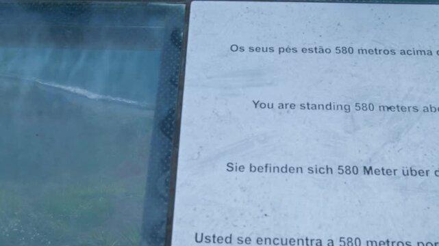 Glass skywalk looking down at the sea from cabo girao in madeira