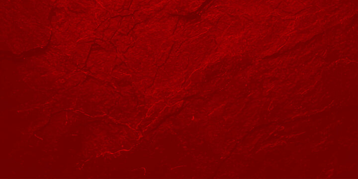 Vibrant red textured background with crimson color and rough stone like surface for design and decoration