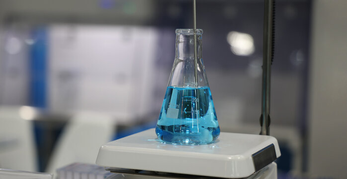 Sciene laboratory. Close up of Modern laboratory scenes with glassware tube reactors and colorful liquids in testing and analysis processes. Chemistry research pharmaceuticals biotechnology concepts.