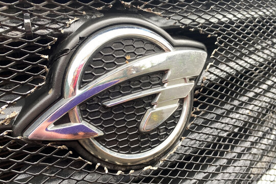 Kyiv Ukraine April 6, 2026: Close up shot of a weathered honeycomb grille with a Ravon chrome emblem, showing the worn badge and mesh.
