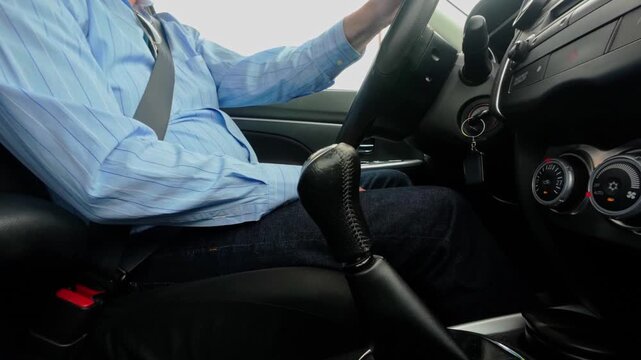 closeup of man inside a car while driving