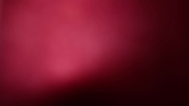 Una toma de cerca de un fondo abstracto de color rojo o anaranjado con negro un degradado ligero desenfocado en movimiento