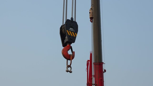 Crane machinery, equipment to lifting heavy object in construction or building operation. Industrial operation scene and equipment object.