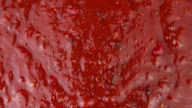 Red Arrabbiata sauce texture circle rotation close up top view