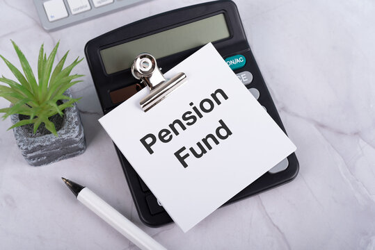 Calculator and paper note with text Pension Fund
