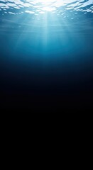 Obraz premium Abstract view of the deep blue ocean, where sunlight fades away into the dark, mysterious, crushing depths far below the waves, Deep, aquatic, background