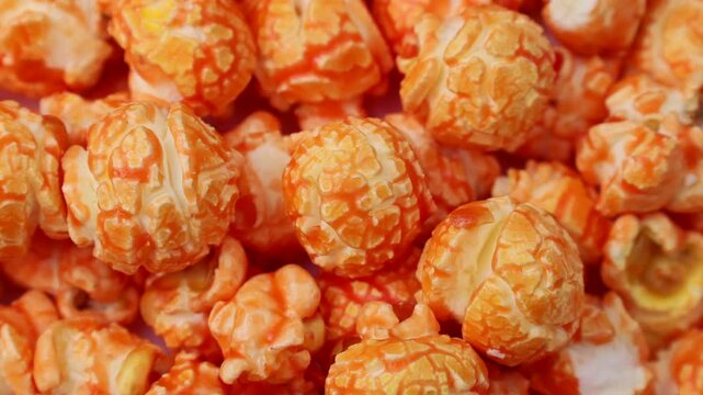 Bright orange fruit popcorn circle rotation close up