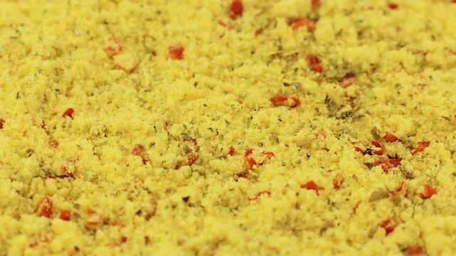 Yellow chicken stock powder seasoning texture circle rotation close up