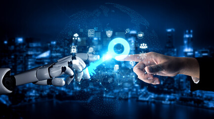 Fototapeta premium Futuristic Interaction Between Human Hand and Robotic Hand Reaching Out Towards Digital Key Icon Against City Skyline Background Sigmoid