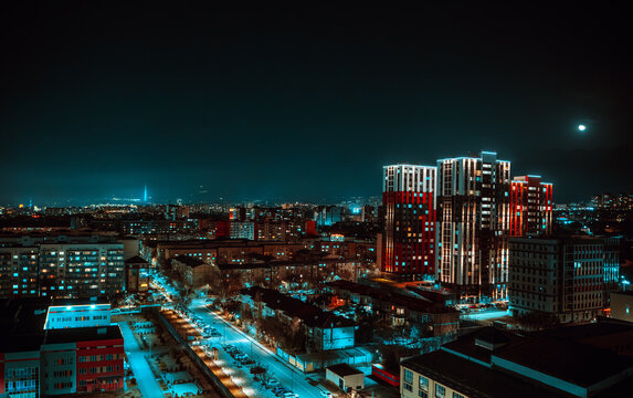 Almaty city skyline at night with illuminated buildings and urban lights