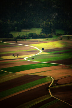 Sunlit Farmland Landscape in Austria, beautiful view with the roads