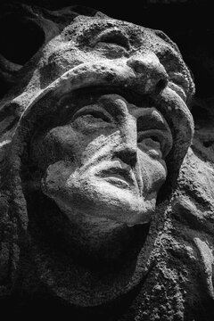 Stone sculpture of Hercules wearing Nemean lion skin, symbol of strength, heroism and ancient mythology