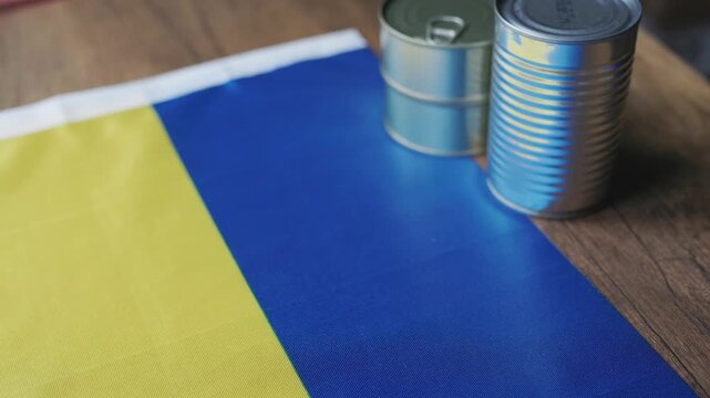 Canned Foods on Ukrainian National Flag Close-up