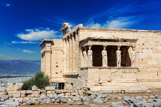 Ancient Erechtheion or Erechtheum temple with Caryatid Porch on the Acropolis, Athens, Greece. World famous landmark at the Acropolis Hill.