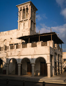 Traditional Arabic wind tower (Barjeel) in Dubai&rsquo;s historic Al Fahidi neighborhood Bastakiya district of Dubai, UAE, on a sunny day.