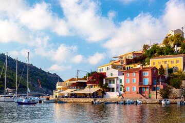 Obraz premium Colorful houses with yachts in Assos village on Kefalonia Island in Greece