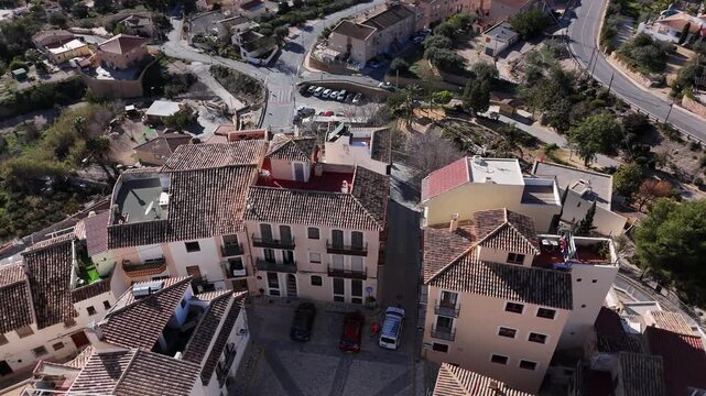Aerial view of Finestrat old town with tiled roofs Spain
