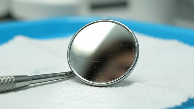 Polished Dental Instrument Reflection. Sterile Dental Tools Reflected Softly On Mirror Surface. Highresolution Macro Image Capturing Sterile Dental Reflection With Surrounding Instruments