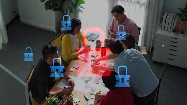 A diverse group collaborates around a table in a modern office, brainstorming innovative ideas while emphasizing security and teamwork in their work environment. Raster