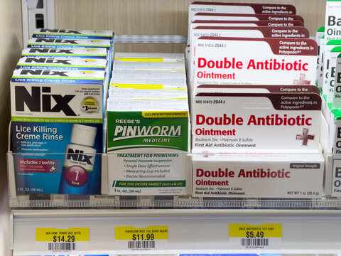 Nix Lice Killing Cream Rinse Pinworm Medicine And Double Antibiotic Ointment Products On Pharmacy Shelf Display
