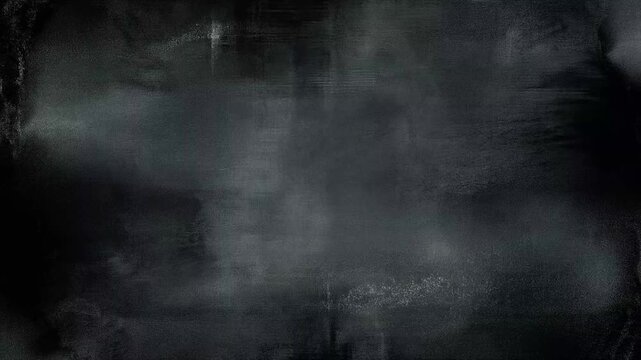 Dark chalkboard with smudged, faded scratch marks. Faint streaks hint at recent use or wear