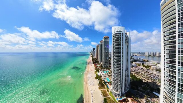 Ultra wide aerial Miami Sunny Isles Beach highrise condos on the beach 4k 2026