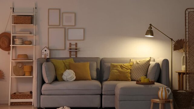 Stylish modular sofa and other furniture in room. Camera moving forward