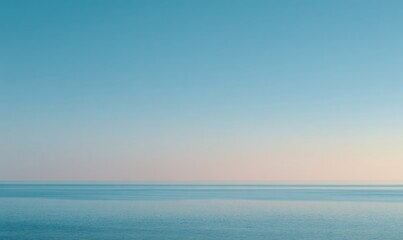 Fototapeta premium Horizon line divides serene ocean and pastel sky
