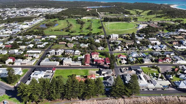 Robe, South Australia Coastline: 4K aerial drone footage of coastal town, houses and estates, marina, sandy beaches, ocean shoreline, cliffs and seaside landscape, local traffics and roads
