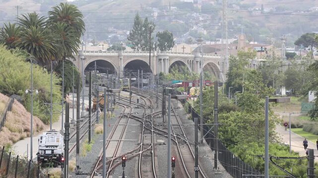Light Rail Train Travels From Under A Bridge
