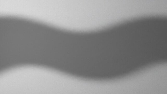 Abstract blurred grey wave pattern with subtle shadow for background use, modern minimalist design element