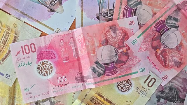 Stack of different denominations of Banknotes of Maldives, Maldivian rufiyaa, full frame business background