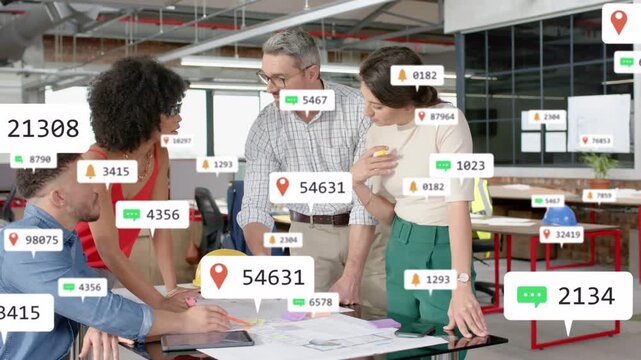 Vertical video: Designers reviewing plans for design, man marking tablet causing AR around team