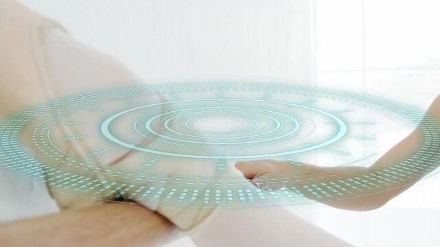 Assistant holding beige pad while holo ring appearing, adjusting recipient chest for medical exam