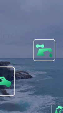 Vertical video: Appearing, green icons drifting over rocky coast and ocean, showing CO2, car, euro