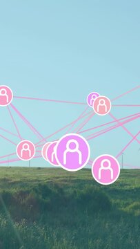 Vertical video: On play purple pink node network shifting over hill, centering purple node for tech